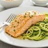 Garlic Butter Salmon with Zucchini Noodles on a white plate