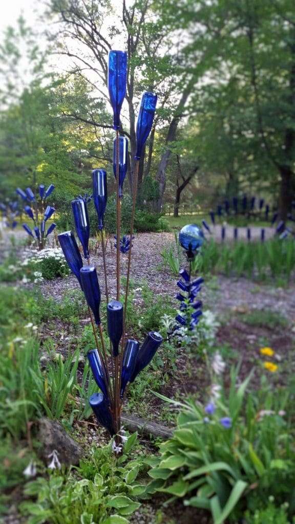 blue bottle tree sculpture for a Hippie Garden Ideas