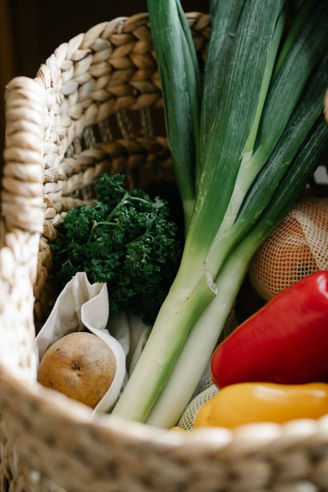 selection of winter vegetables in a rattan basket