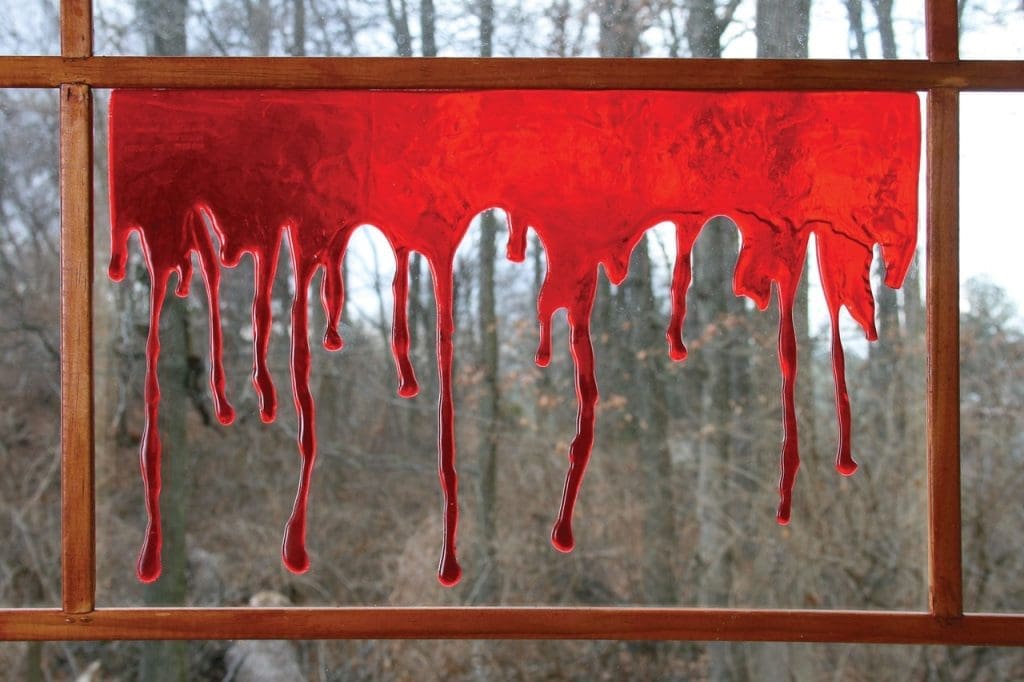 easy DIY halloween window pianting of red stains on window