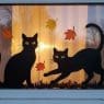 Halloween Window Painting of two black cats in a window