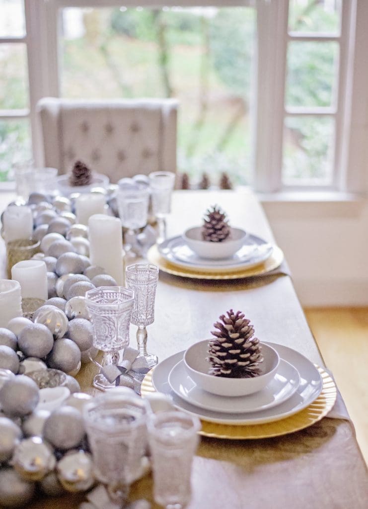 glitter pinecones on a christmasy style table