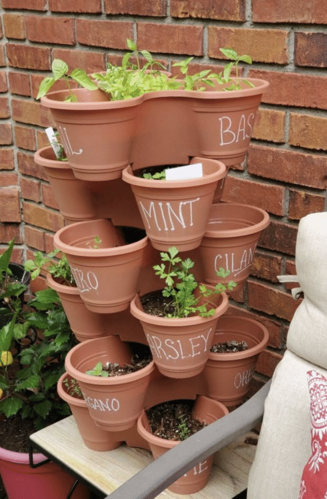 Stacked herb pots outside in garden
