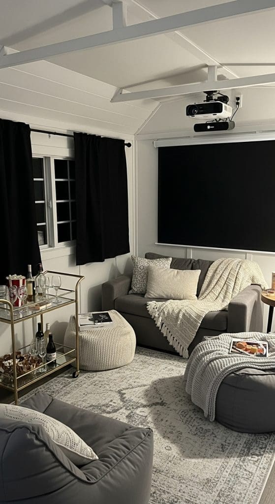 she shed movie night zone with comfy chairs and screen